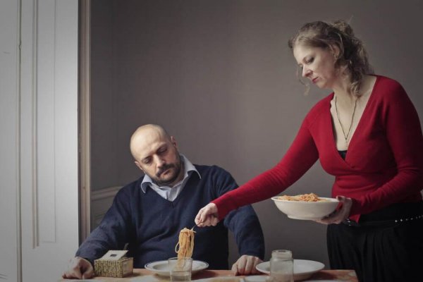 Gender discrimination: a woman serving a man food.