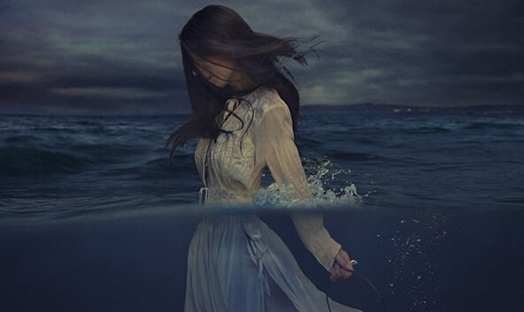 Woman walking in sea