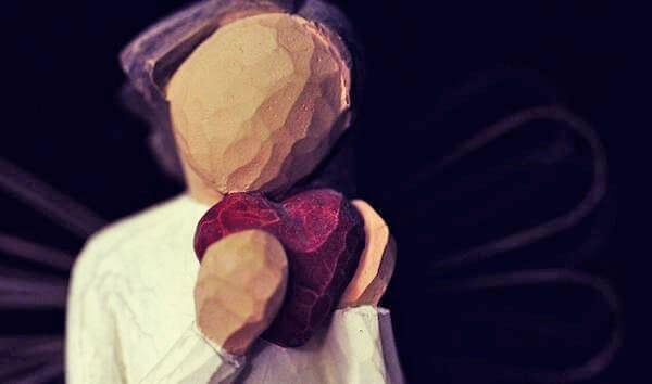 figure holding heart