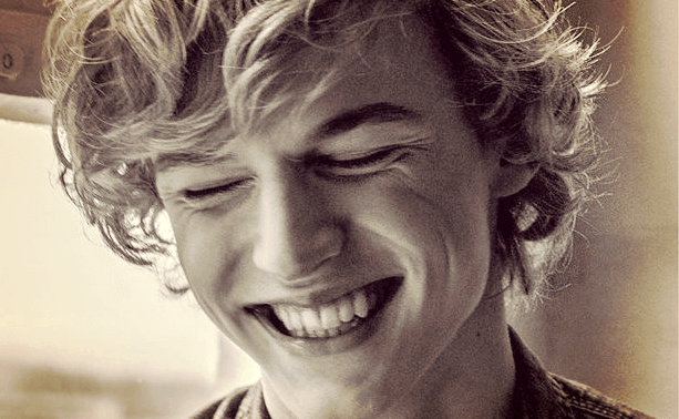 A young man smiling and self-realized