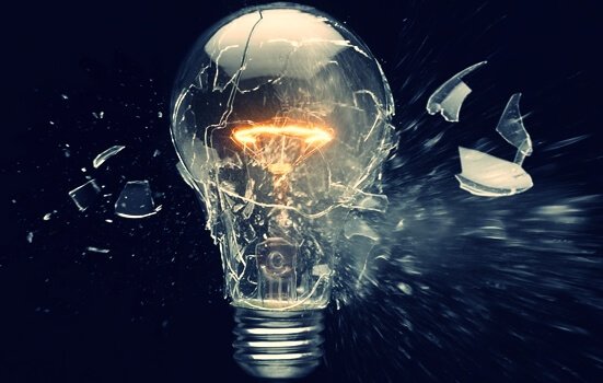 A light bulb blowing up as a sign of obsolescence