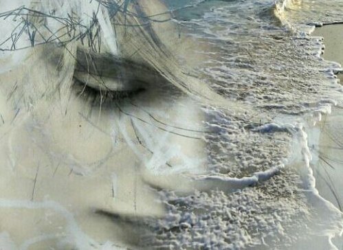 A sad face on a beach.