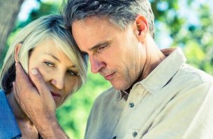 A worried middle-aged couple.