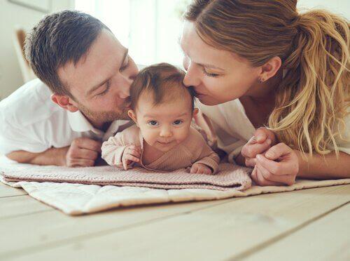 baby with parents representing Prenatal Psychology