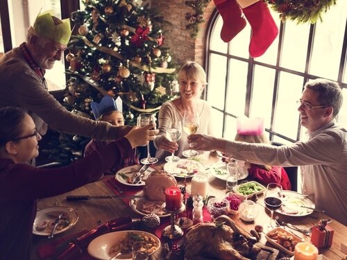 Family eating Christmas dinner.