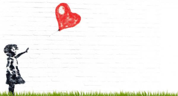 A little girl will say goodbye to her red heart balloon.