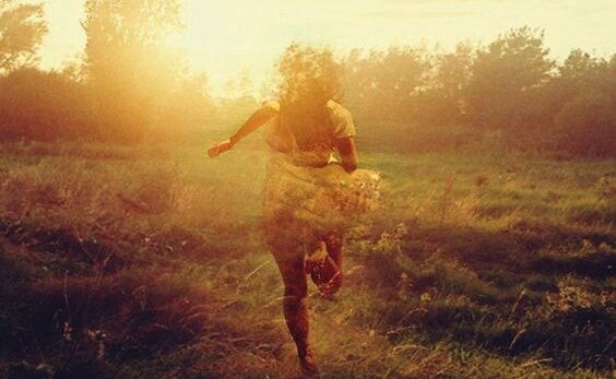 A girl running from tough times towards encouragement. 