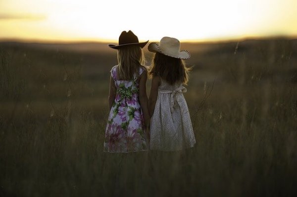 girls in a field building friendships