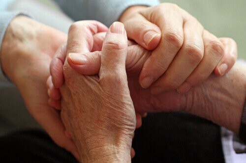 compassion as pictured by holding hands.