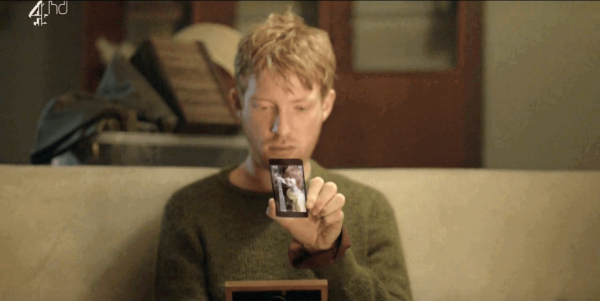 Ash in Black Mirror looking at his mobile