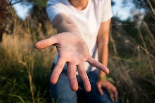 outstretched hand symbolizing philanthropy
