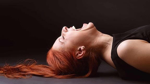 person laughing wildly symbolizing pathological laughter