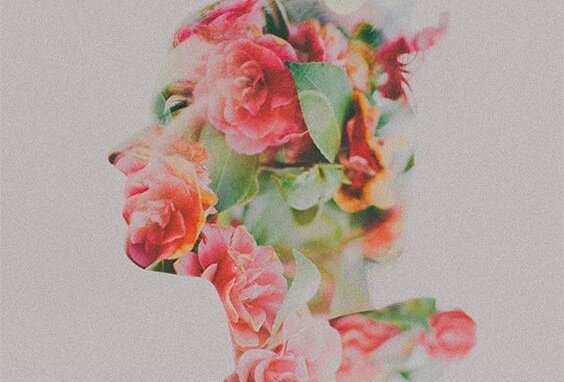 A silhouette of a woman covered in flowers.