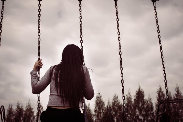 Sad, black-and-white scene on the swings.