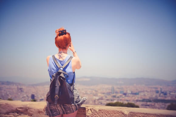 woman disconnecting from her job by traveling