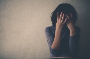 Woman crying after consuming alcohol.