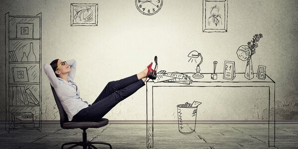 Woman with feet up on desk