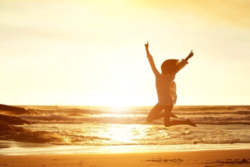 Woman jumping on beach