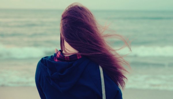 Girl looking out to sea