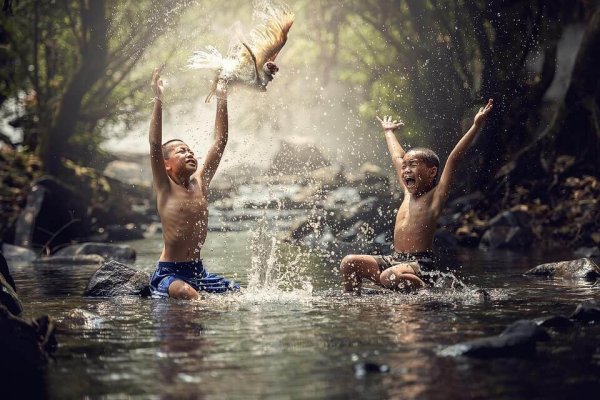 boys playing in river demonstrating cultural evolution