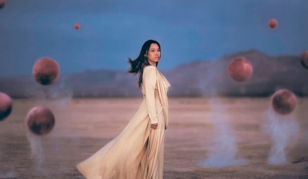 Girl surrounded by spheres