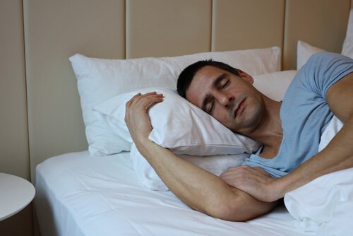 man asleep in bed after following tips for getting better sleep