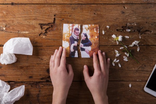 torn photo symbolizing one of the myths about infidelity, that there's no love anymore
