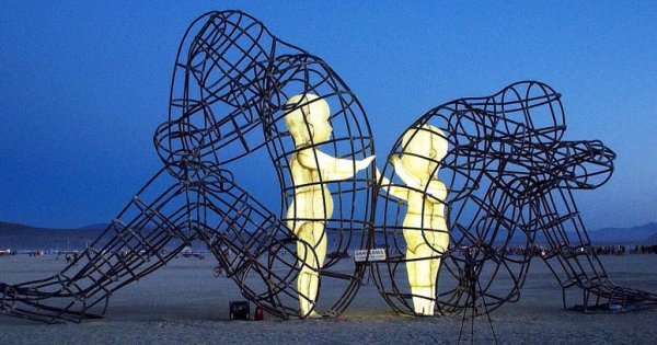 two statues of little boys trapped inside sad adults