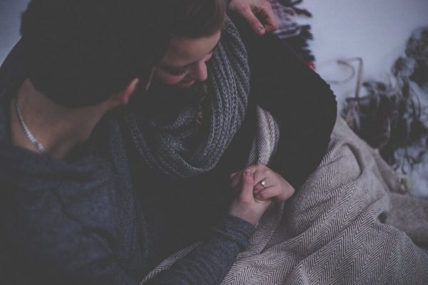 A couple hugging.