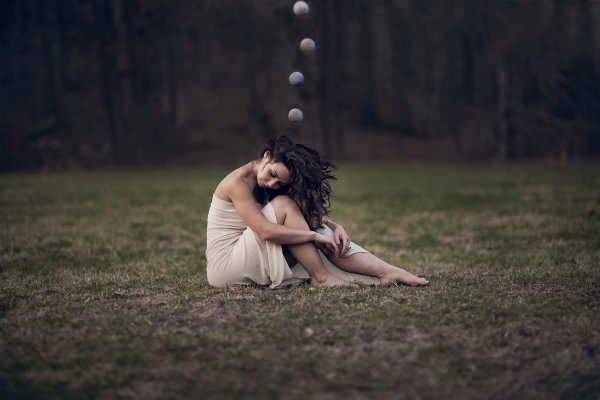 Girls with sphere surrounding her