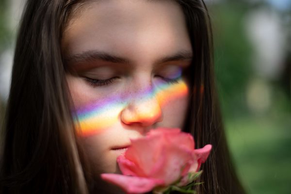 girl smelling a rose