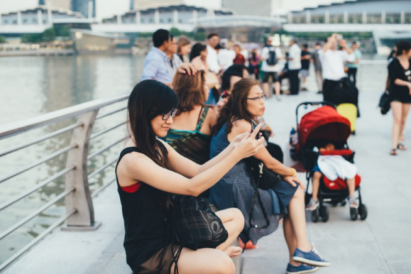 girl taking a selfie improving her self-esteem
