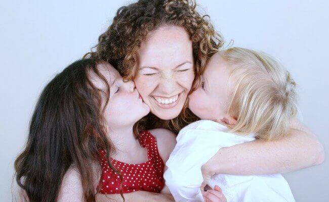 mother smiling with her children