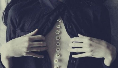 A woman with flowers on her back.