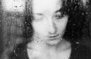 sad woman in the window
