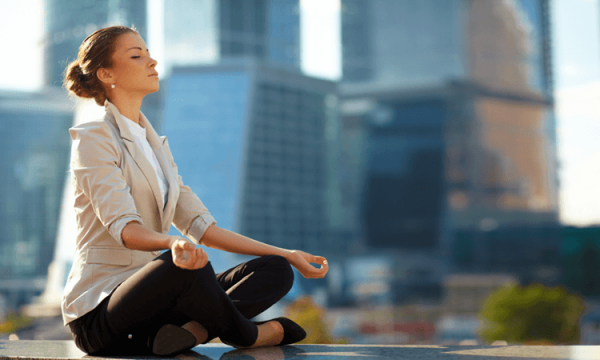 Woman practicing mindfulness at work.
