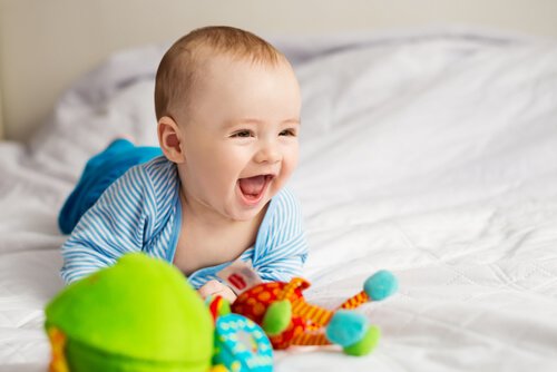 A baby smiling and laughing.