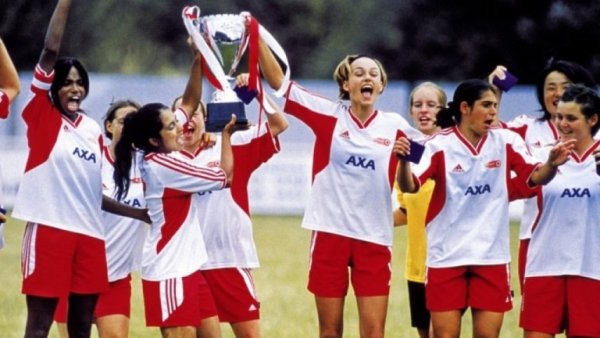 Girls winning a trophy.