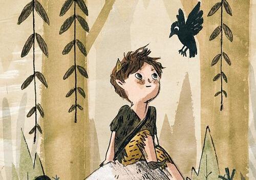 Boy smiling while looking at a crow.