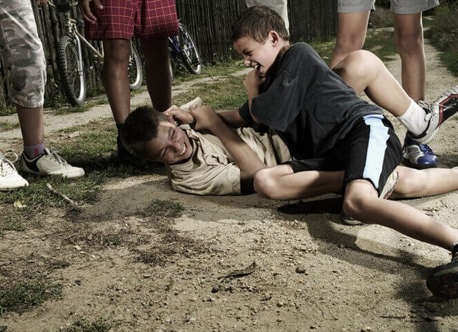 Boys fighting.