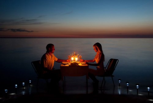 Couple enjoying a romantic dinner.