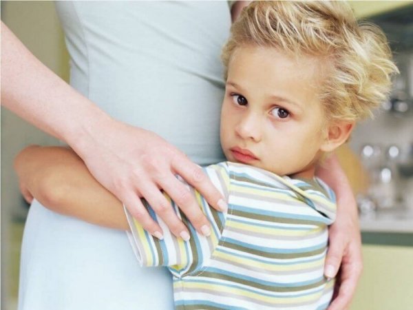 A child hugging his mother depicting dependency.