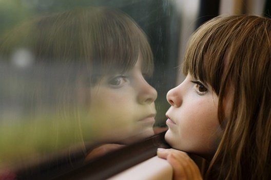 Child looking out the window.