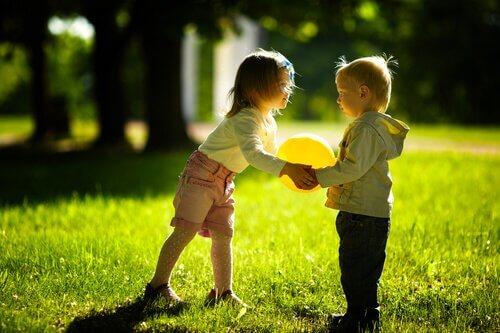 Children playing with a balloon shows the importance of playtime in children.
