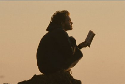 Christopher reading a book.