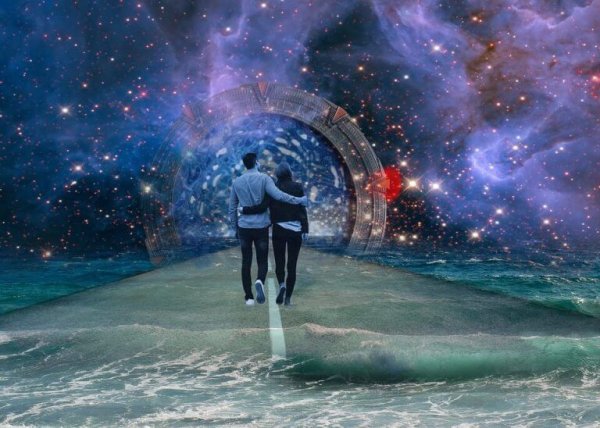 Couple walking down road with galaxies in the background.