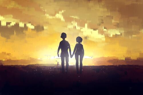 A couple walking together hand in hand.