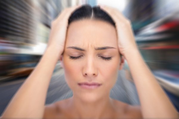 Woman dealing with frequent dizziness from her anxiety.