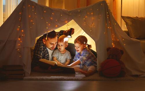A happy family reading.