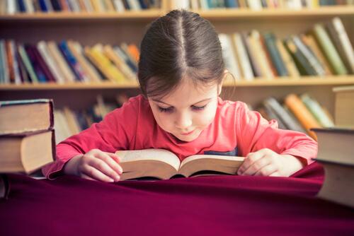 A little girl reading.